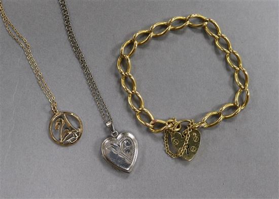 An 18ct gold bracelet, a 9ct gold pendant and chain, and silver locket on chain.
